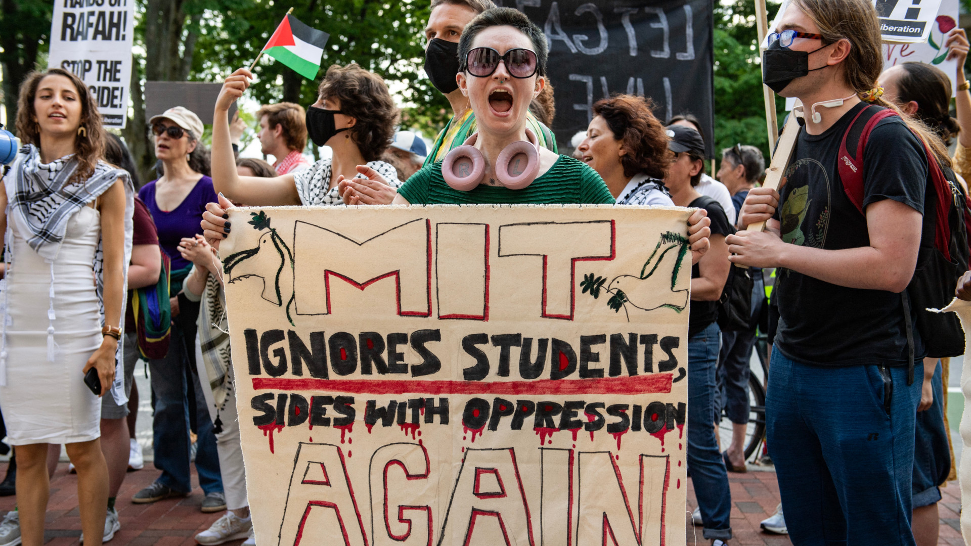 Pro-Palestinian protesters chant holding signs and flags at a rally in front of the Massachusetts Institute of Technology (MIT) in Cambridge, Massachusetts, on 28 May 2024 (Joseph Prezioso/AFP)