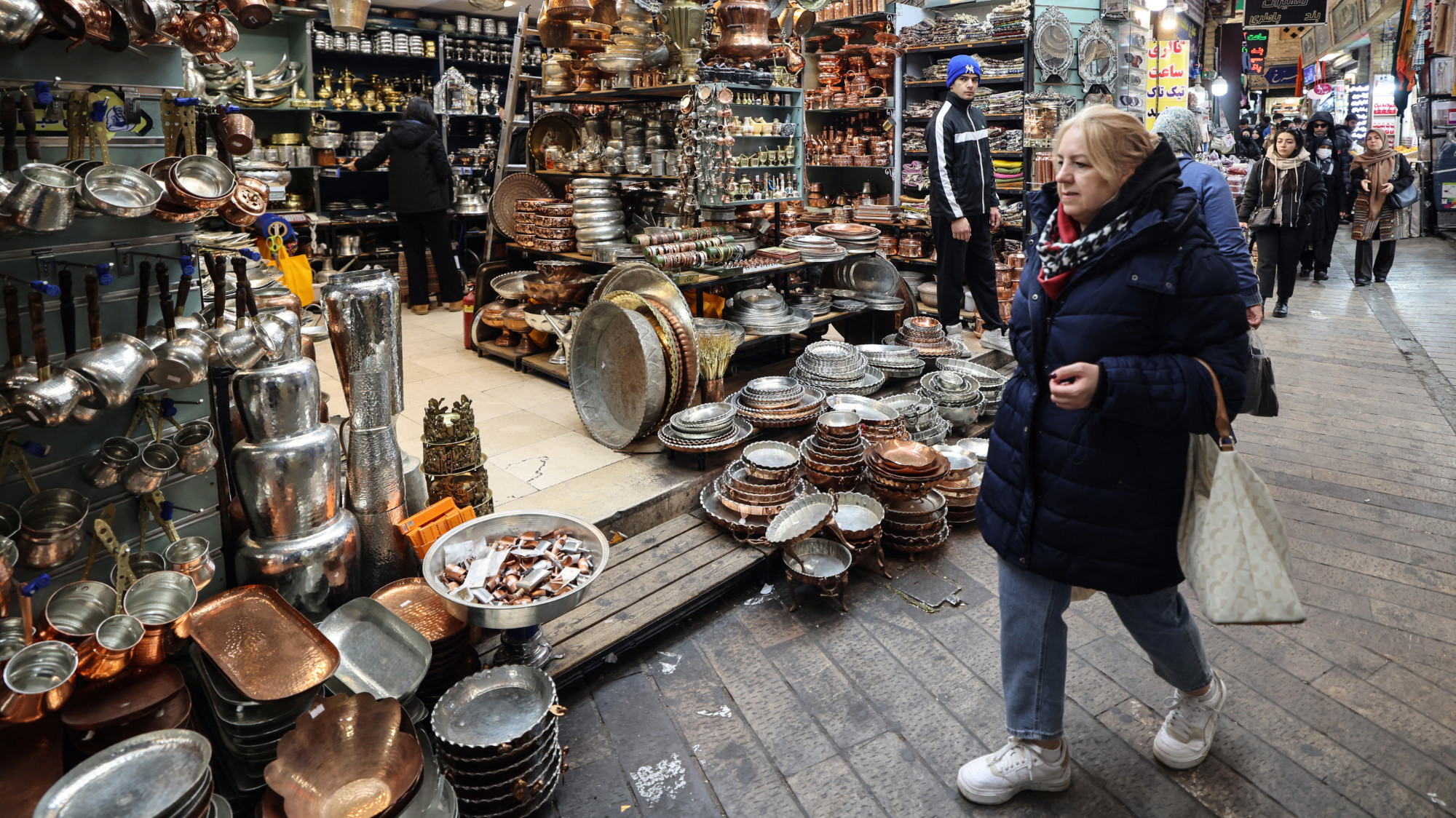 People shop at Tajrish Bazaar in the Iranian capital Tehran on 29 December 2025 (AFP/Atta Kenare)