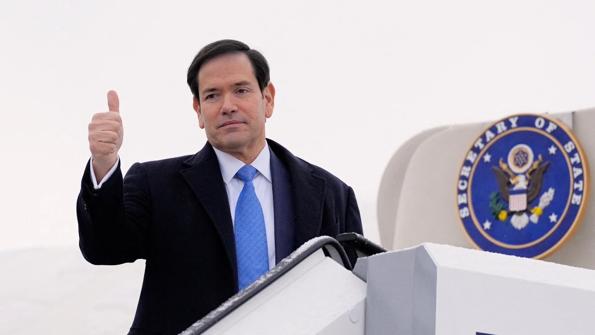 US Secretary of State Marco Rubio gives a thumbs up as he departs Munich International Airport in Munich, Germany, on 15 February 2026, after attending the Munich Security Conference (Alex Brandon/Pool via Reuters)
