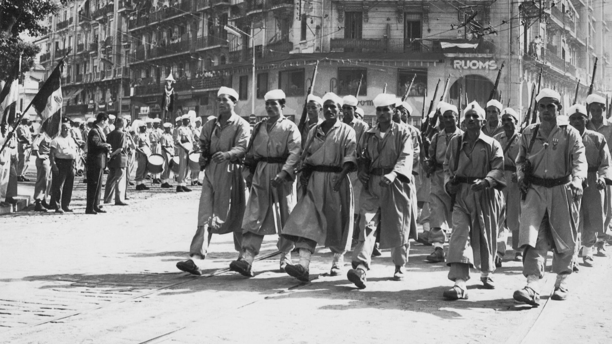 Algerian Harkis, who fought on the French side, march in Algiers in 1957 (AFP/Jacques Grevin)