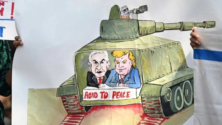 An antiwar protester in New Delhi holds a placard depicting US President Donald Trump and Israeli Prime Minister Benjamin Netanyahu, on 3 March 2026 (Sajjad Hussain/AFP)