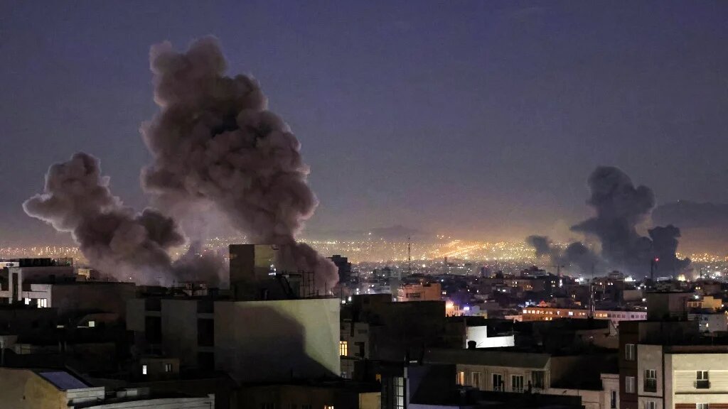 Smoke rises after missile strikes in Tehran on 1 March 2026 (Atta Kenare/AFP)