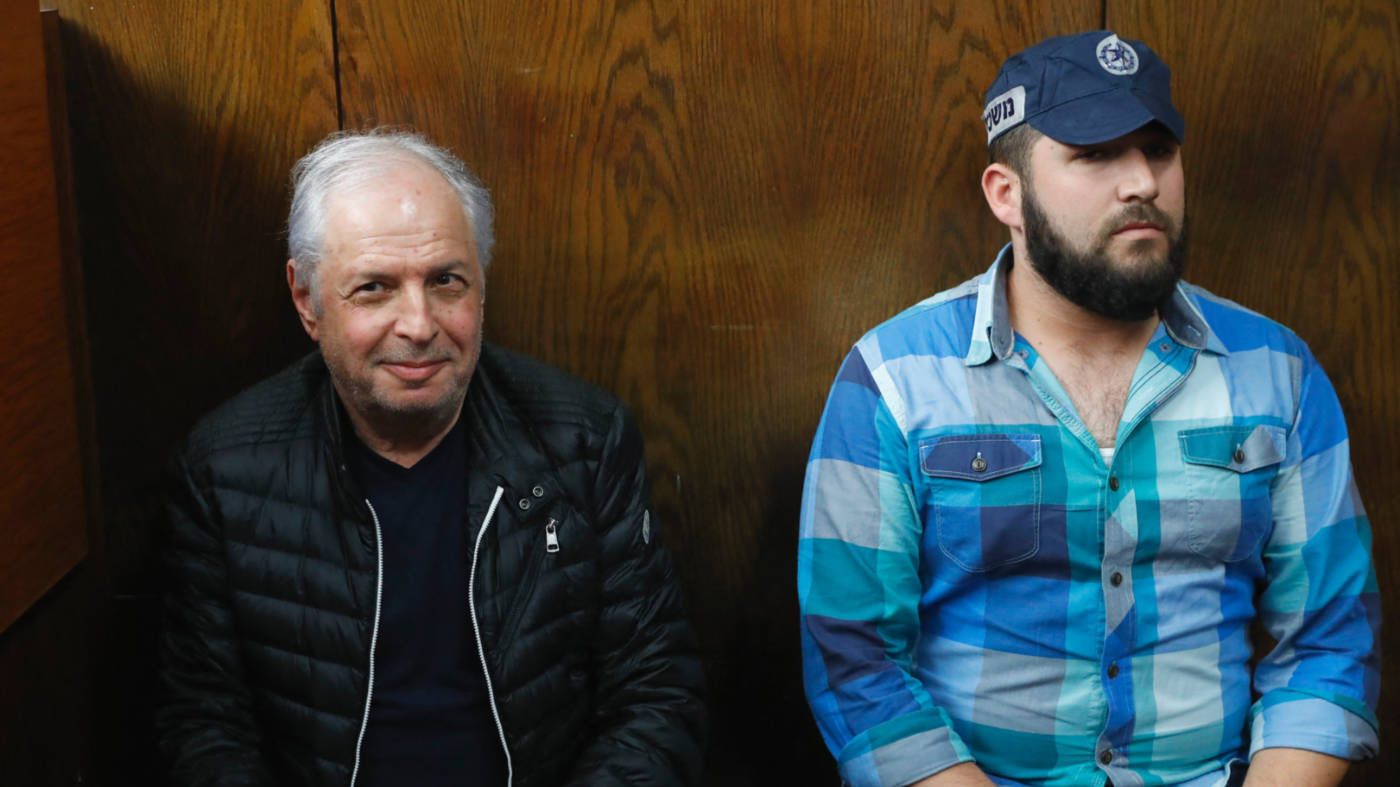 Israeli tycoon Shaul Elovitch (left) appears in the Justice Court in Tel Aviv on 22 February 2018 (AFP)