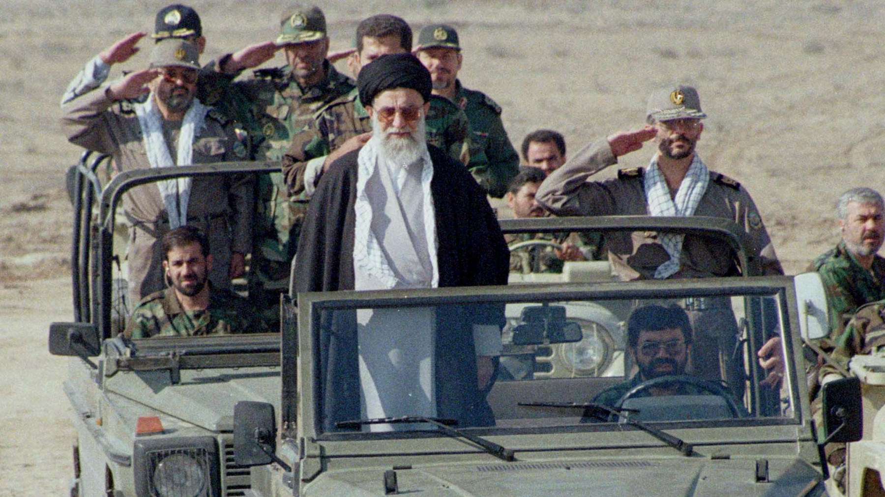 Ayatollah Ali Khamenei, stands in front of a jeep as he inspects 110,000 Basij militia volunteers, October 20, 2000, during manoeuvers in support of the Palestinian Intifada against Israel (Reuters)