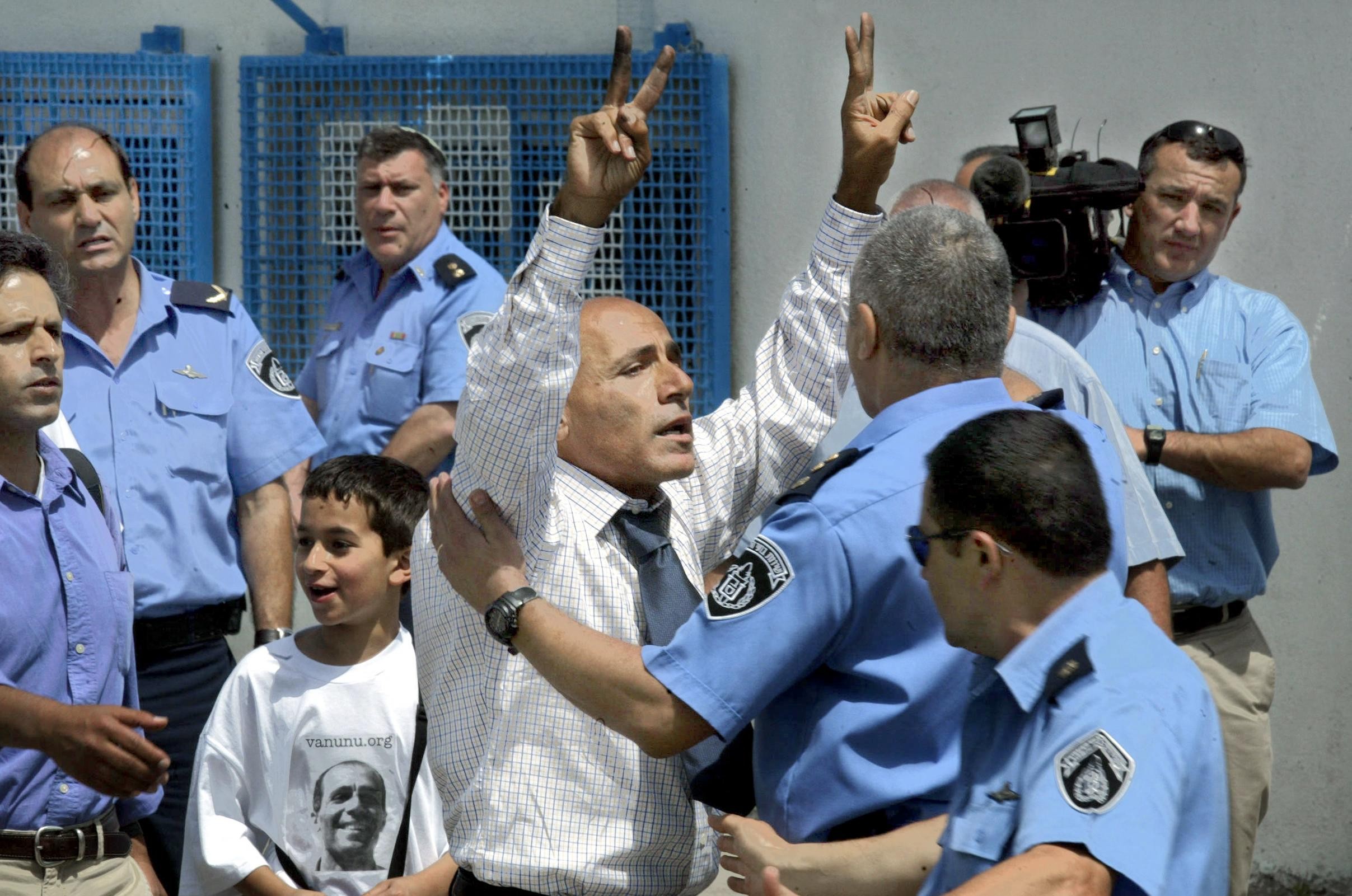 Former Israeli nuclear technician Mordechai Vanunu walks free out of the high security prison of Shikma in Askelon, southern Israel on 21 April 2004 (AFP/Menahem Kahana)