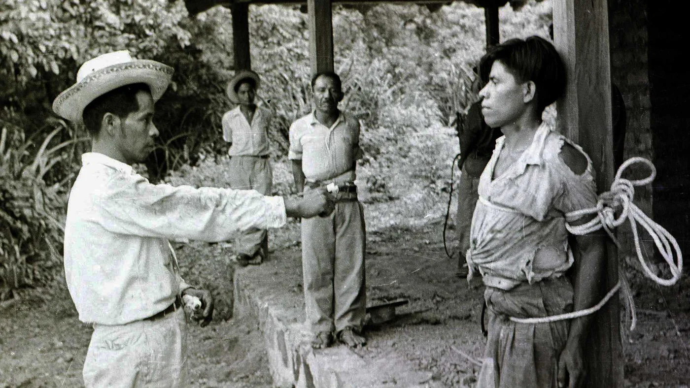 Guatemalan supporters of Colonel Castillo Armas guard prisoners allied to recently deposed President Jacobo Arbenz in September 1954 (AFP)