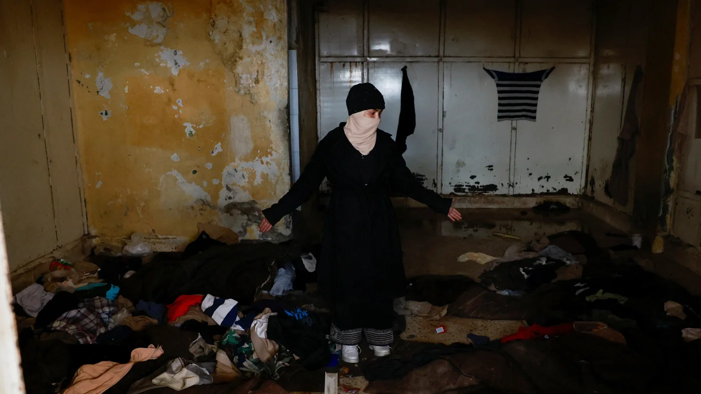 Hayat Turki searches for her brother who was imprisoned in Sednaya prison (Ammar Awad/Reuters)