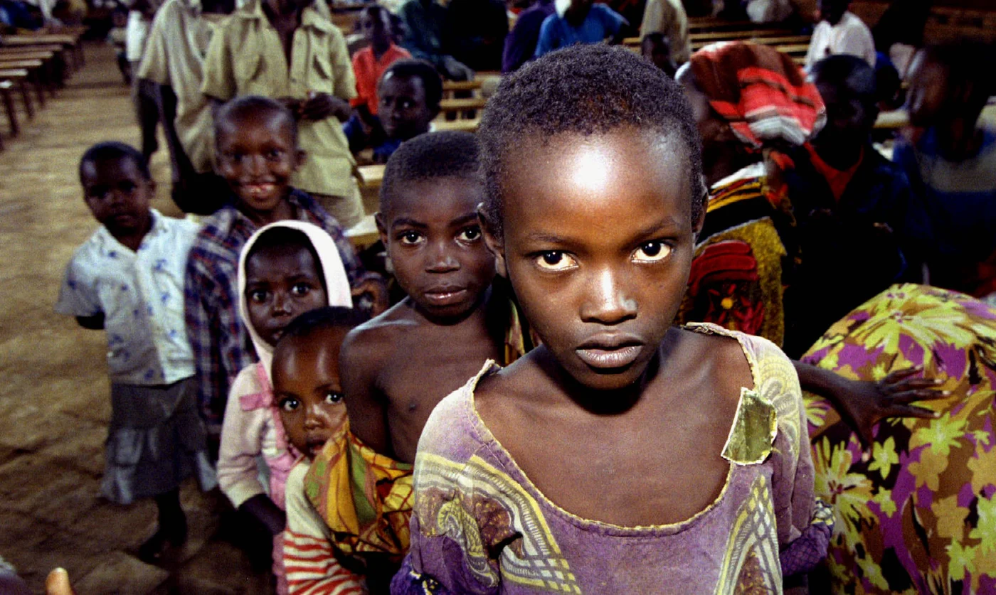 Tutsi children, seeking refuge from Hutu militias, queue for food in the government controlled part of Kigali, Rwanda, in May 1994 (Reuters)