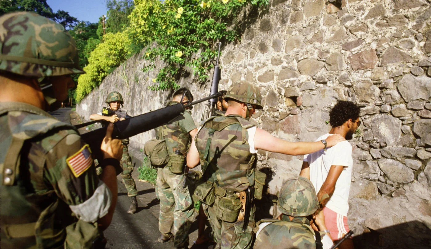 US soldiers arrest Marxist supporters in St George's, Grenada, in October 1983 (AFP)