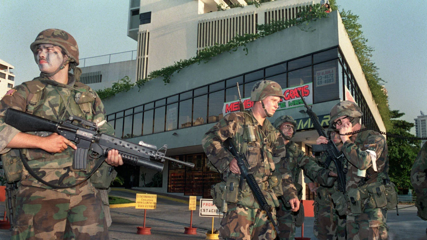 US soldiers outside the Vatican embassy in Panama City, where President Manuel Noriega sought asylum,  on 24 December 1989 (AFP)
